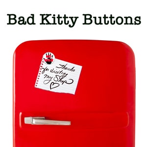 May include: A red refrigerator with a white note that says "Thanks for visiting my shop" and a red and black button that says "No War" on it.