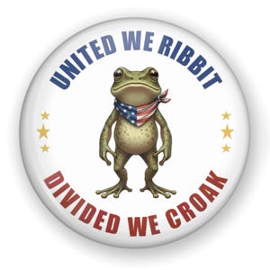 May include: A white button with a cartoon frog wearing a patriotic bandana. The button has the text "UNITED WE RIBBIT" in blue and "DIVIDED WE CROAK" in red, with three gold stars on each side of the frog.