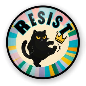 May include: A round decorative plate with the word "RESIST" in black block letters. A black cat with yellow eyes kicks a gold crown. The background has a radial design with pastel colors.