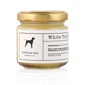 May include: A small glass jar of White Truffle product with a gold lid. The label features a black silhouette of a dog and the text "TRUFFLES USA". The ingredients and origin are also listed on the label.