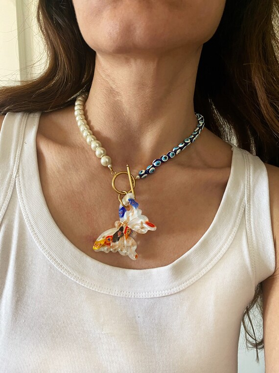 Butterfly evil 2024 eye necklace