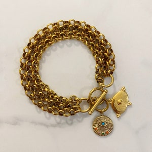 Gold tone coin  bracelet, coin bracelet, toggle bracelet with coin charms, Chunky  bracelet, vintage style  bracelet, evil eye bracelet,