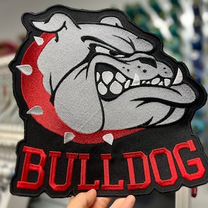 May include: Black and red embroidered patch with a cartoon bulldog face and the word "BULLDOG" in red lettering.