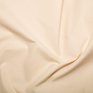 May include: A close-up of a smooth, off-white fabric with a slight sheen. The fabric is folded and draped, showing its texture and drape.