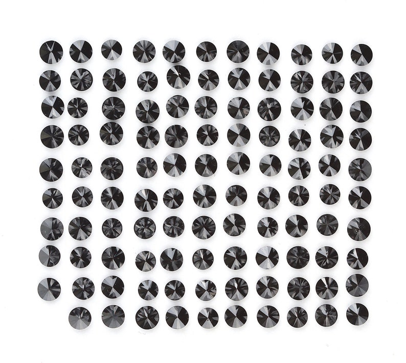 May include: A sheet of black diamond-shaped rhinestones, arranged in a grid pattern.