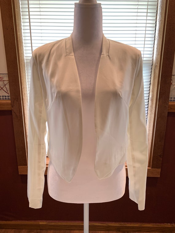 Never worn, creamy white short waist jacket