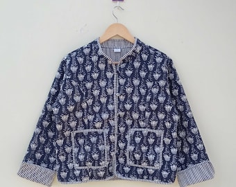 May include: A navy blue jacket with a white floral print and a striped trim. The jacket has a button closure and two pockets.