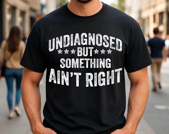 Camiseta vintage divertida y sarcástica con el mensaje: Sin diagnóstico, pero algo no anda bien.