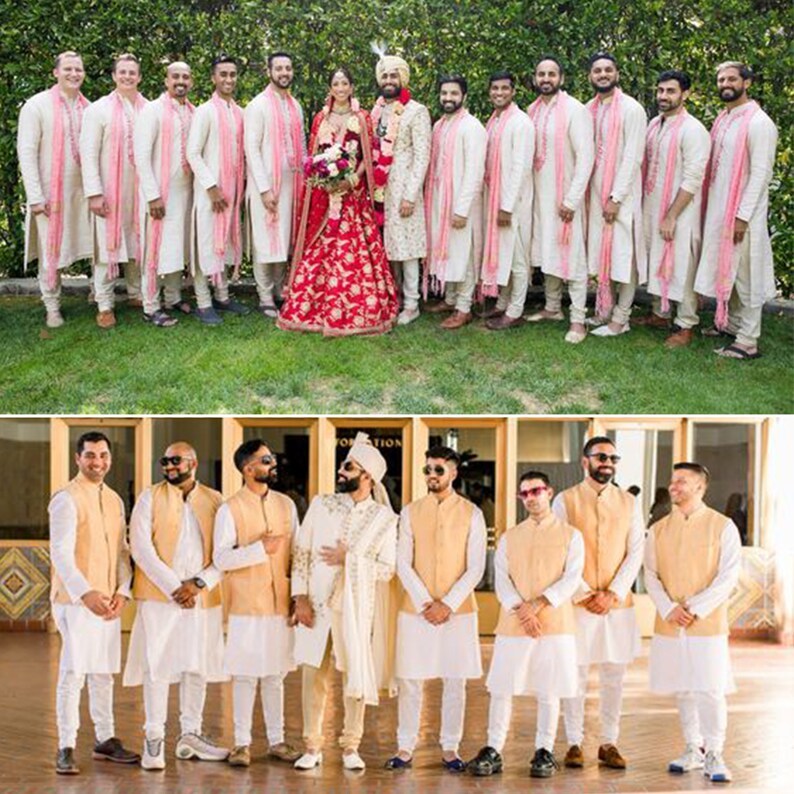 May include: Two groups of men wearing white kurtas and cream-colored shawls. The first group is standing in a line, while the second group is standing in a semi-circle. The men in the first group are wearing gold vests and are standing on a tiled floor.