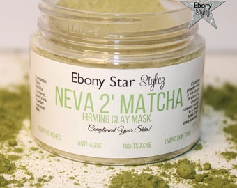 May include: A clear jar with a green powder inside. The label reads "Ebony Star Stylez NEVA 2' MATCHA FIRMING CLAY MASK Compliment Your Skin!" with the words "Tightens Pores", "Anti-Aging", "Fights Acne", and "Evens Skin Tone" below. The jar is sitting on a bed of green powder.