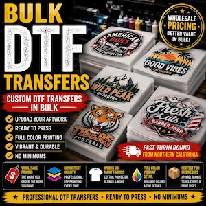 May include: Stacks of custom DTF transfers featuring various graphic designs including a tiger, mountain landscape, barber shop logo, and California sunset. The transfers are clear sheets with full-color printed artwork, ready for heat pressing onto fabric.
