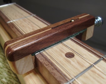 Dulcimer Capo made of Walnut and Curly Maple /Maple stripe.