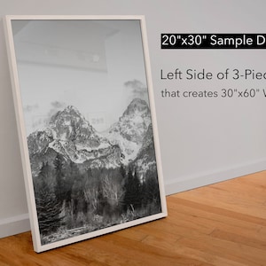 May include: A black and white photograph of a mountain range with snow-capped peaks. The image is framed in a white frame and is labeled "20"x30" Sample Display Left Side of 3-Piece Set that creates 30"x60" Wall Art".