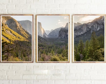 May include: Three framed landscape photographs of a mountain valley with a forest in the foreground. The photos are in a row, with the leftmost photo showing a mountainside with a forest in the foreground, the middle photo showing a valley with a forest in the foreground, and the rightmost photo showing a mountainside with a forest in the foreground.