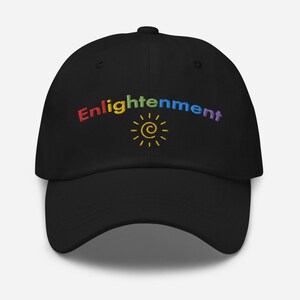 May include: Black baseball cap with a rainbow embroidered logo that says "Enlightenment" and a yellow sun with a swirl inside.