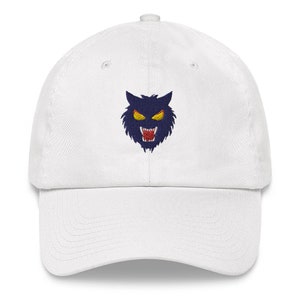 May include: White baseball cap with an embroidered black and blue wolf's head with yellow eyes. The wolf is snarling with its mouth open.