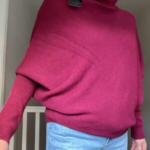 Roll Neck Draped Asymmetric Jumper by Alpini Knitwear Burgundy