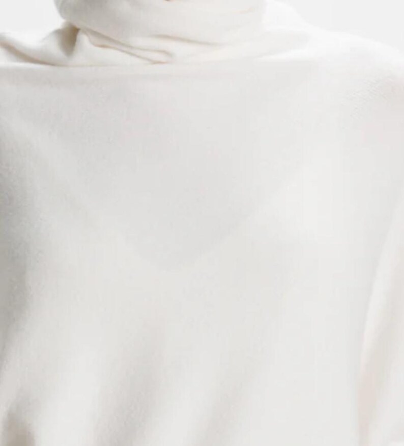 Roll Neck Draped Asymmetric Jumper by Alpini Knitwear Ivory