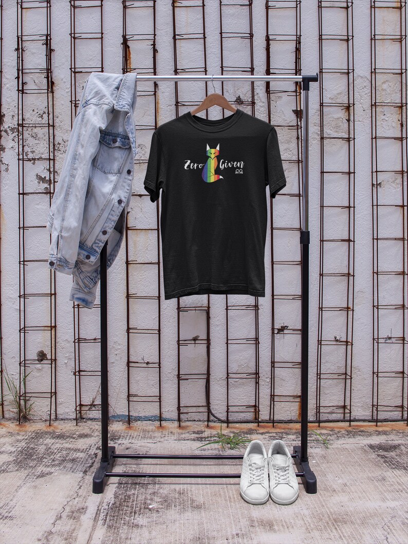 May include: Black t-shirt with a rainbow fox graphic and the text "Zero Given".