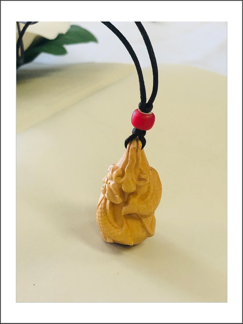 Boxwood Gourd Pendant Necklace features Cod Jump Over Dragon Gate