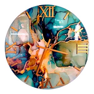 May include: Round wall clock with a teal, gold, and white abstract design. The clock face features gold Roman numerals and hands. The design has a marbled effect with gold accents.