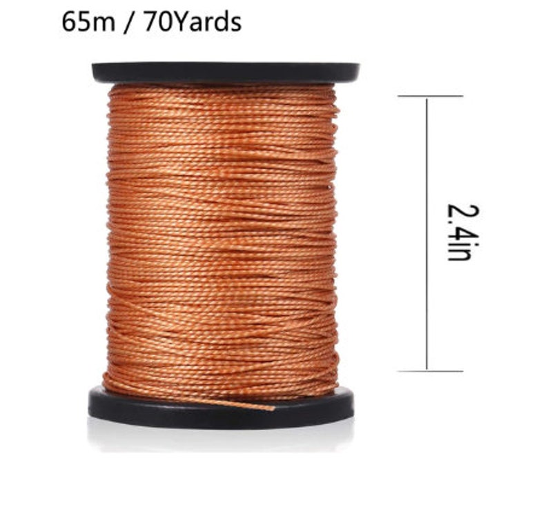 May include: A spool of orange thread with 65 meters or 70 yards of thread. The spool is 2.4 inches tall.