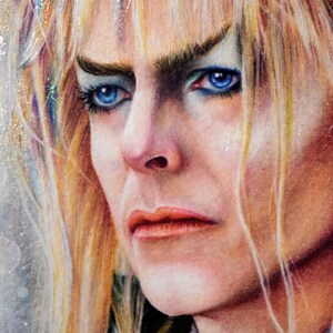 May include: A close-up portrait of a person with long, blonde hair. The person has blue eyes and is wearing makeup. The person has a serious expression on their face.