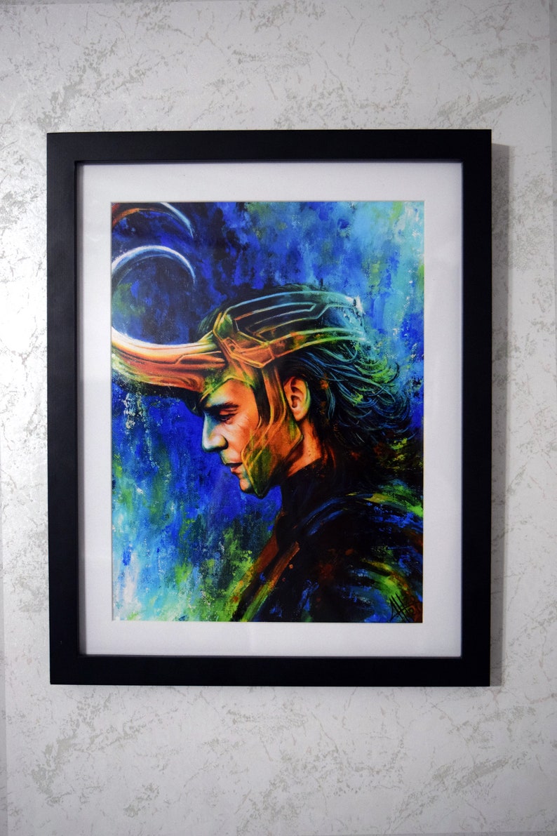 May include: A framed painting of a man with dark hair wearing a gold helmet with a horn. The background is an abstract design in shades of blue, green and yellow.
