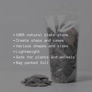 Flat slate rock fragments, used to shape terrain and add contrast in terrariums, vivariums, and underwater plant environments.