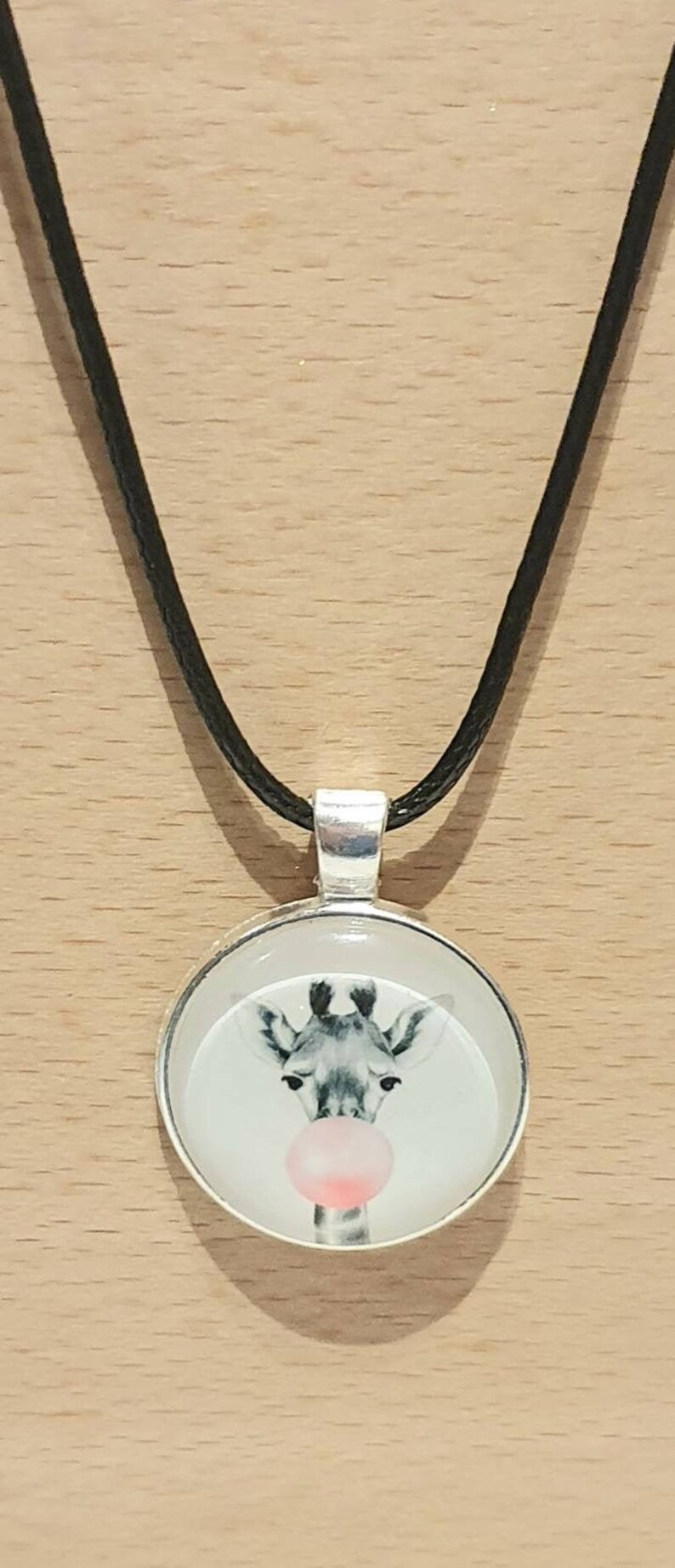 20mm cute giraffe cabachon bezel pendant necklace on an 18 inch black waxed chain.