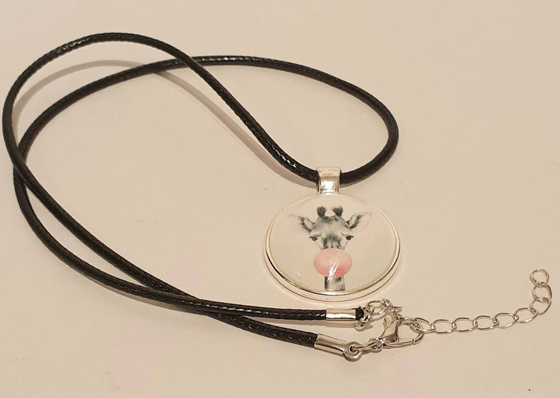 20mm cute giraffe cabachon bezel pendant necklace on an 18 inch black waxed chain.