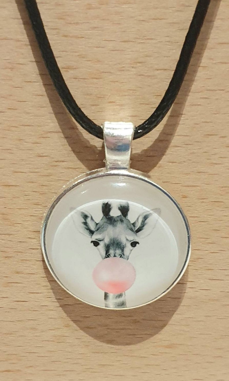 20mm cute giraffe cabachon bezel pendant necklace on an 18 inch black waxed chain.