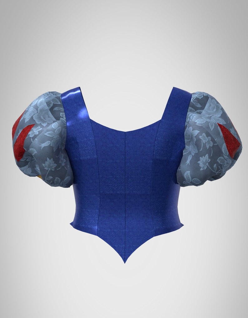 Puede incluir: Un corpi&ntilde;o azul con la parte inferior puntiaguda y mangas abullonadas. Las mangas son de color azul claro con un estampado floral y detalles rojos.