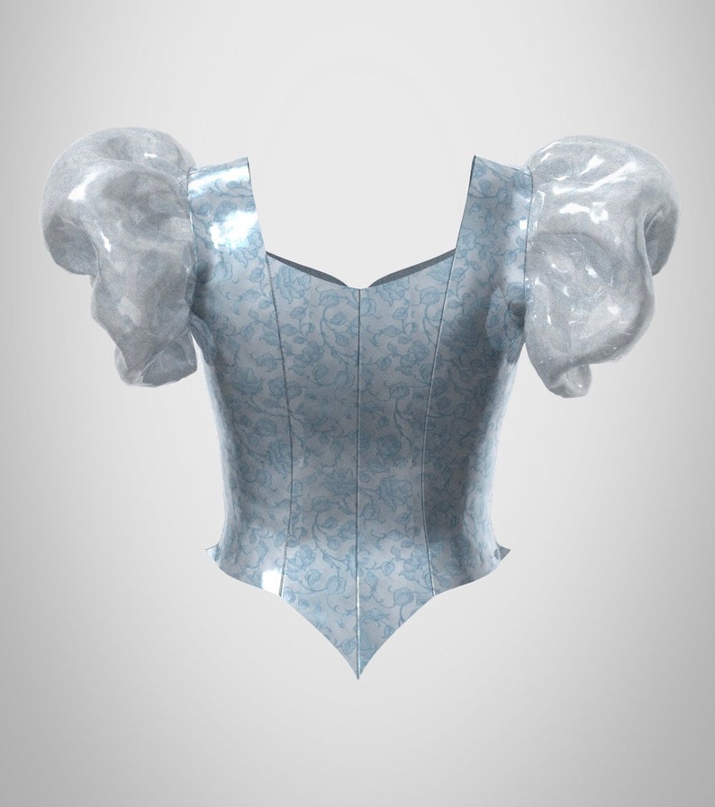 Puede incluir: Un cors&eacute; azul claro con un patr&oacute;n floral y mangas abullonadas. El cors&eacute; tiene un escote de coraz&oacute;n y una parte inferior puntiaguda.