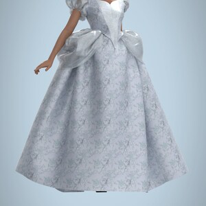May include: A woman wearing a white ball gown with a floral pattern. The gown has a sweetheart neckline and puffed sleeves. The woman has dark skin and her hair is styled in braids.