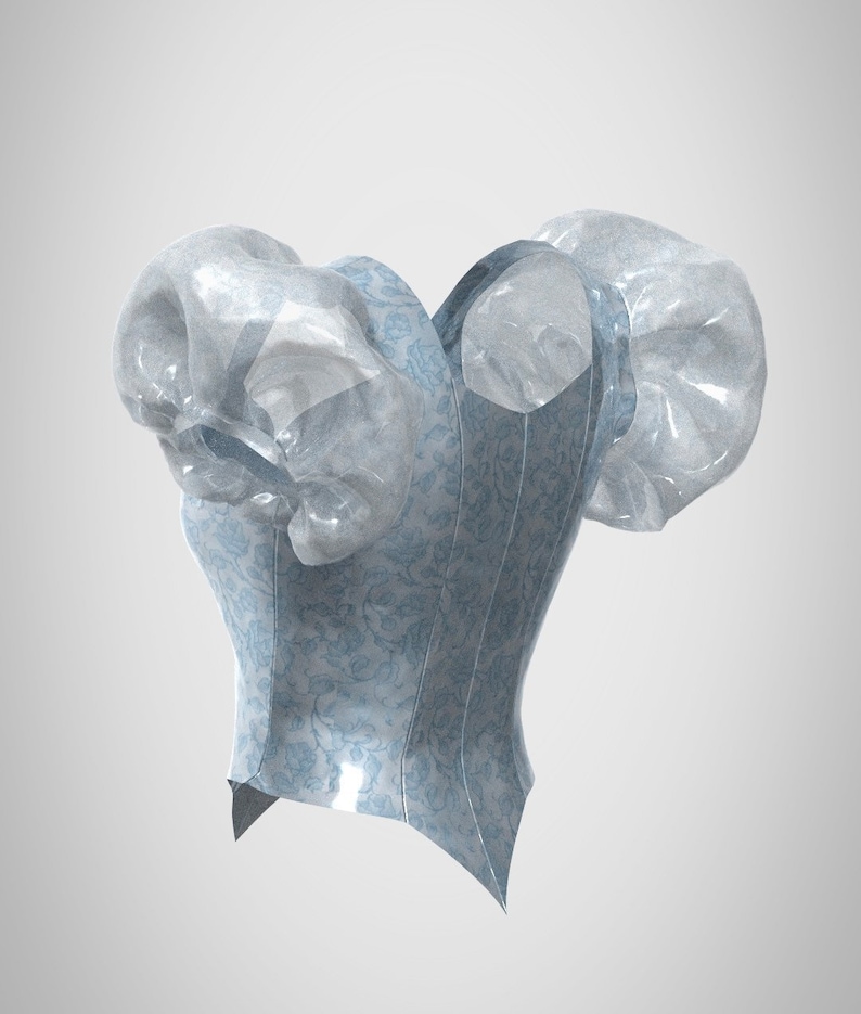 Puede incluir: Un cors&eacute; azul y blanco con estampado y mangas abullonadas. El cors&eacute; est&aacute; hecho de un material brillante, similar al sat&eacute;n.