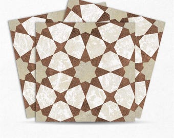 May include: Three brown and white geometric patterned tiles with a starburst design. The tiles are made of ceramic and have a distressed look.