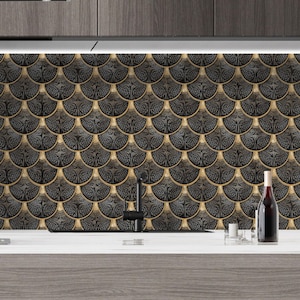 Black Egyptian peel-and-stick tile set in overlapping scallop shapes with tan borders for a 3D vinyl backsplash.