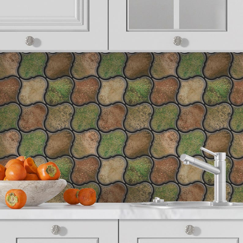 3D peel-and-stick wall tile grid with scalloped square tiles in moss green, brown, and tan for an earthy kitchen backsplash.