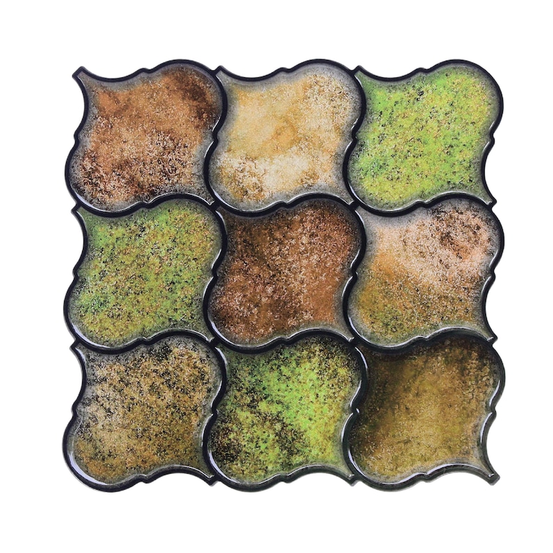 3D peel-and-stick wall tile grid with scalloped square tiles in moss green, brown, and tan for an earthy kitchen backsplash.