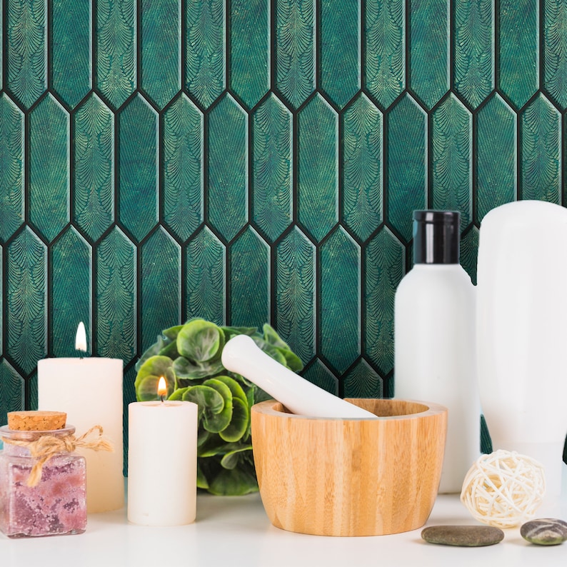 Vanity styling with candles and jars, emerald hexagon peel and stick tile forming a jewel-like bathroom backsplash