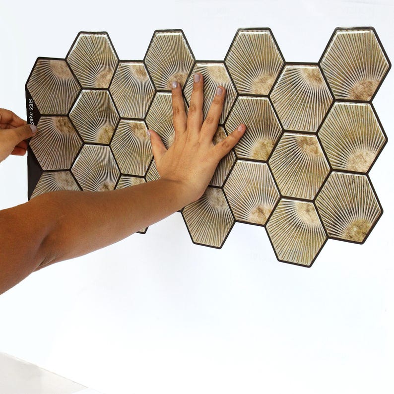 Light brown hexagon peel-and-stick tile sheet for kitchen backsplash; wood-look honeycomb pattern, self-adhesive vinyl tile.