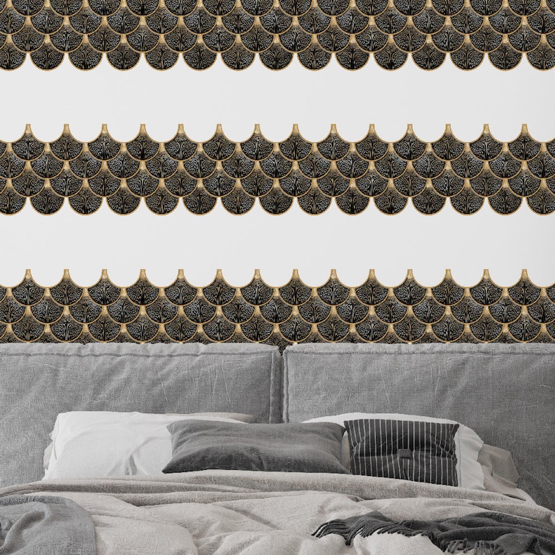 Black Egyptian peel-and-stick tile set in overlapping scallop shapes with tan borders for a 3D vinyl backsplash.