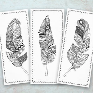 May include: Three black and white printable coloring pages featuring intricate, detailed feather designs. Each feather is filled with various patterns and swirls.