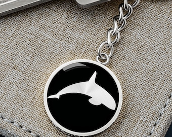 Orca-sleutelhanger met grafische cirkel: chirurgisch staal, 18k gouden afwerking