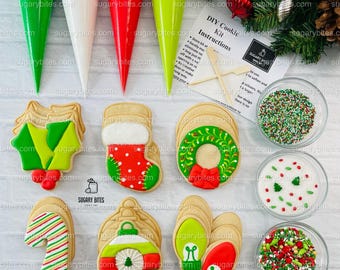 May include: A Christmas cookie decorating kit with six different cookie designs, including a stocking, a wreath, a candy cane, an ornament, and mittens. The kit includes four piping bags, two bowls of sprinkles, and a sheet of instructions. DIY Cookie Kit Instructions. Store kit at room temperature. Gently melt icing to eliminate air bubbles. Simply twist icing bags with no air pockets. Create as many designs as you like. Have fun and make your own.