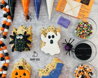 May include: A DIY cookie kit with Halloween-themed cookies, including a ghost, spider, bat, and pumpkin. The kit includes icing bags, sprinkles, and instructions. The brand name is "Sugary Bites".