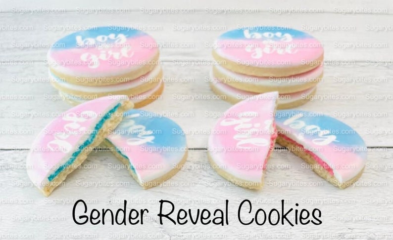 May include: Gender reveal cookies decorated with blue and pink icing and the words "boy" and "girl".