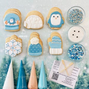May include: A collection of winter-themed cookies, including a penguin, snowflake, and mittens, alongside bowls of sprinkles and icing cones. The cookies are decorated with blue, white, and tan icing. A card with a QR code and text is also present.
