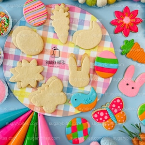 May include: A collection of Easter-themed sugar cookies decorated with colorful icing and sprinkles. The cookies are arranged on a white and pink checkered plate. The plate is surrounded by various sprinkles, piping bags, and yarn balls.